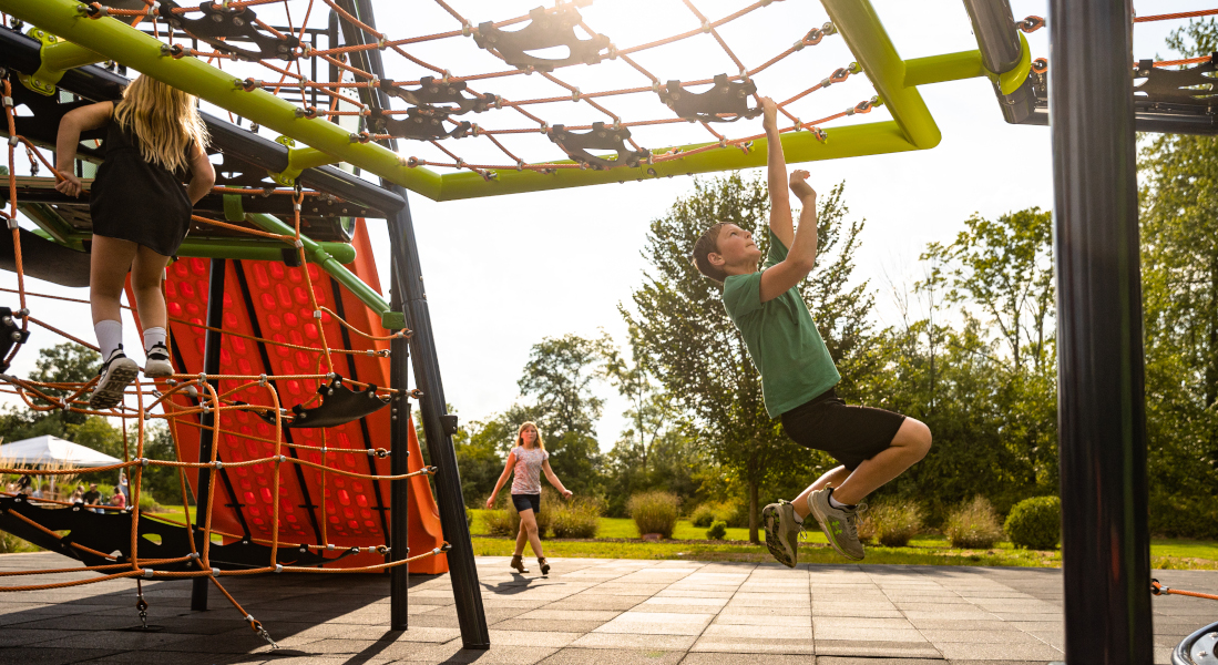Children playing on the rope nets on Playworld's Torres play equipment.
